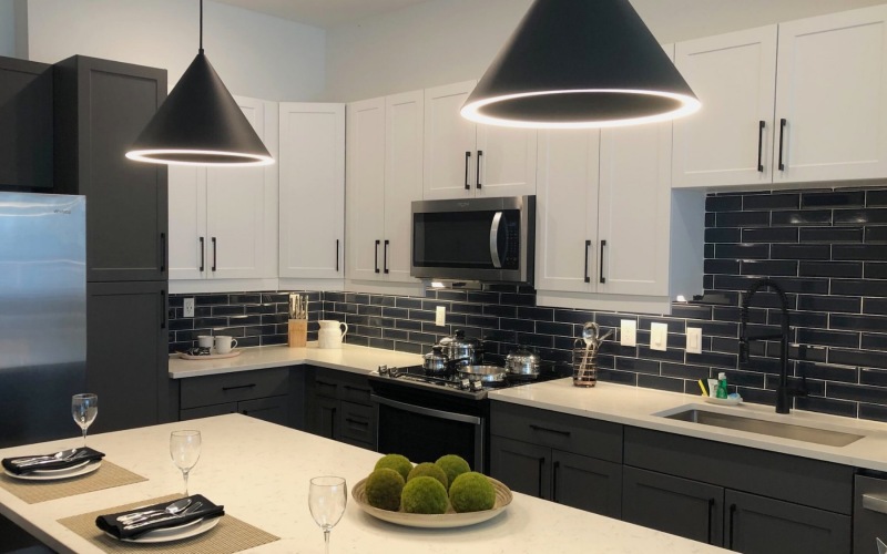 a kitchen with white cabinets