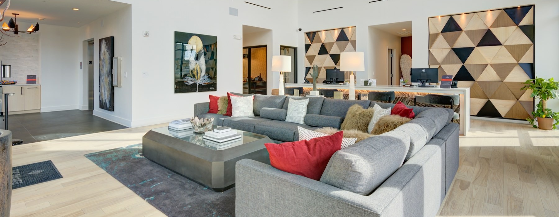 a clubroom with a couch and wall art